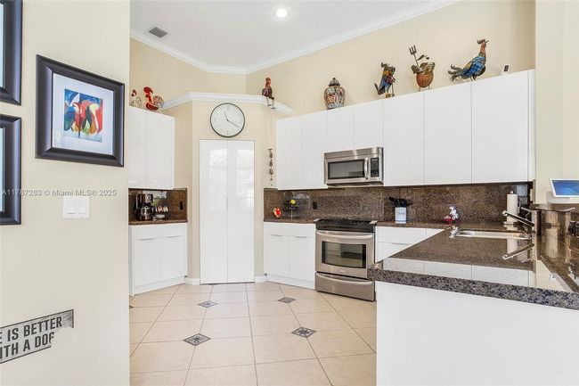 3848 Oak Ridge Cir, House other with 4 bedrooms, 3 bathrooms and null parking in Weston FL | Image 26