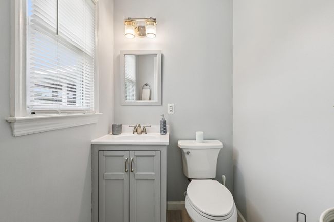 Half bath featuring vanity and toilet | Image 13