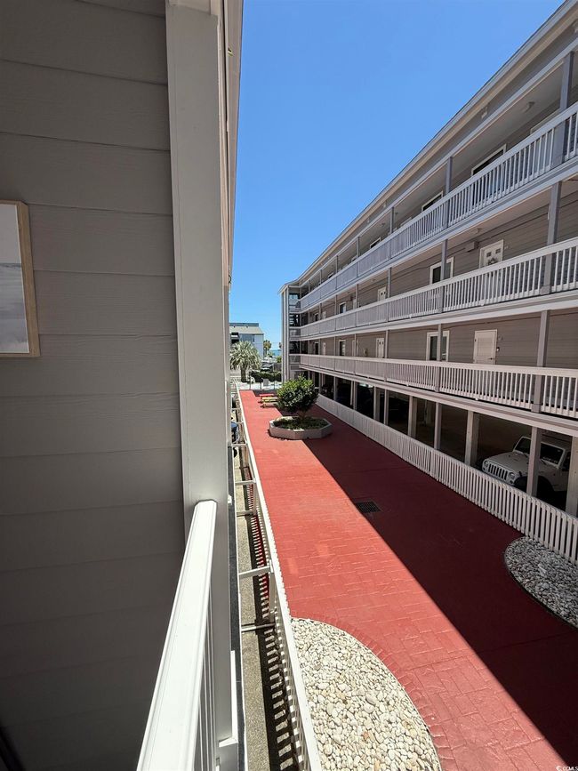 Enjoy a peek of the ocean from the balcony. | Image 26