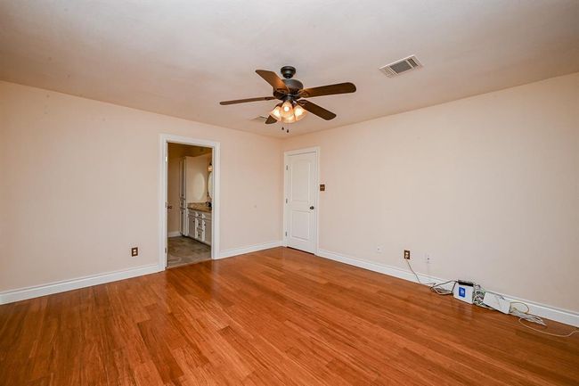 The private master bedroom is complete with an en suite bathroom. | Image 17