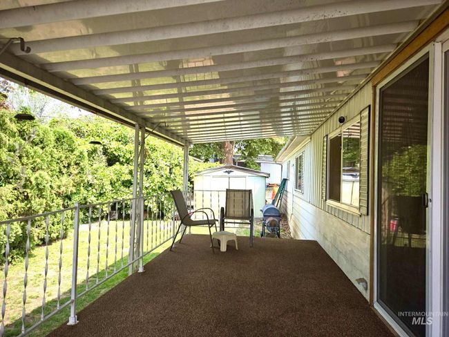 View of patio / terrace featuring a storage shed | Image 9