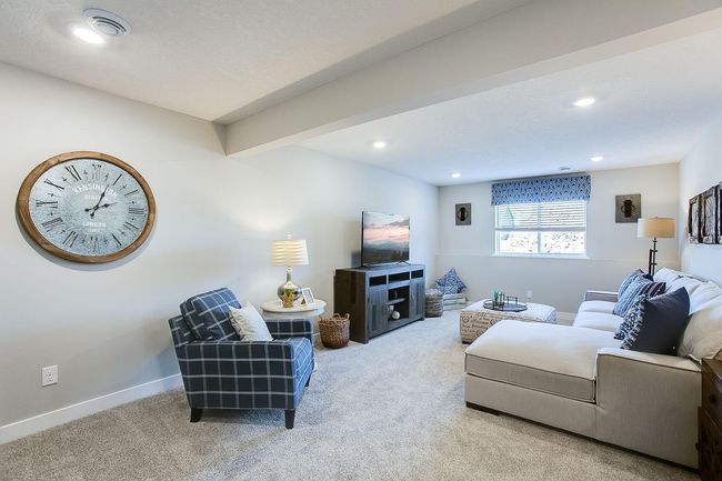 The lower level included finishes features a sizeable rec room, fourth bedroom, and third bathroom. Photos of model home. Colors and options may vary. Ask Sales Agent for details. | Image 33