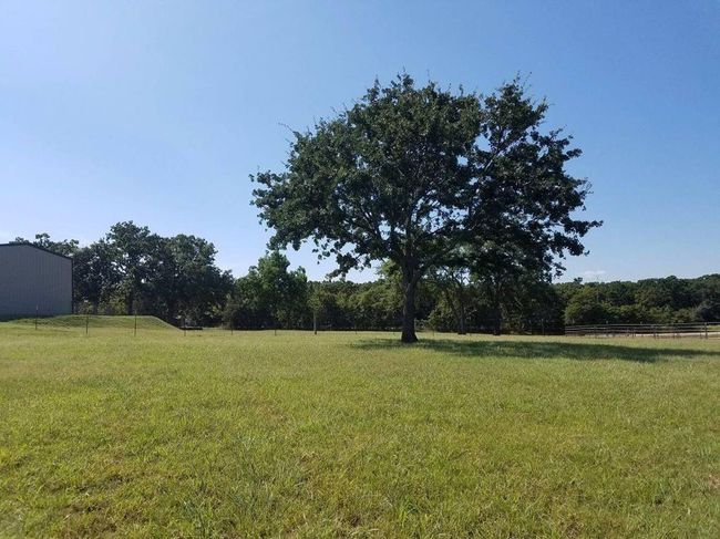 View of yard featuring fence and a rural view | Image 6