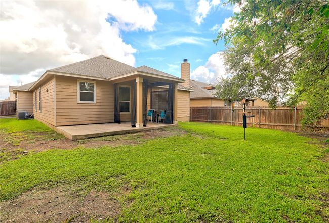 Back of house with a fenced backyard and a patio area | Image 38