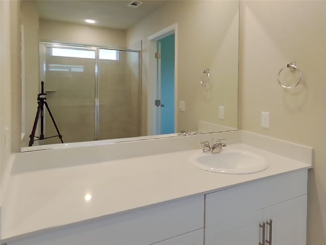 Bathroom featuring a shower stall and vanity | Image 7