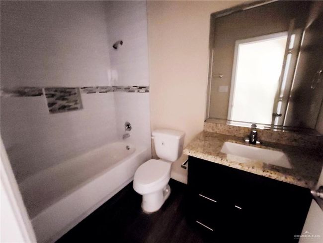 Bathroom with vanity and shower / tub combination | Image 15