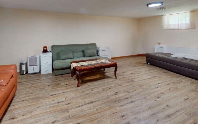 Unfinished basement featuring washer / dryer and heating unit | Image 41