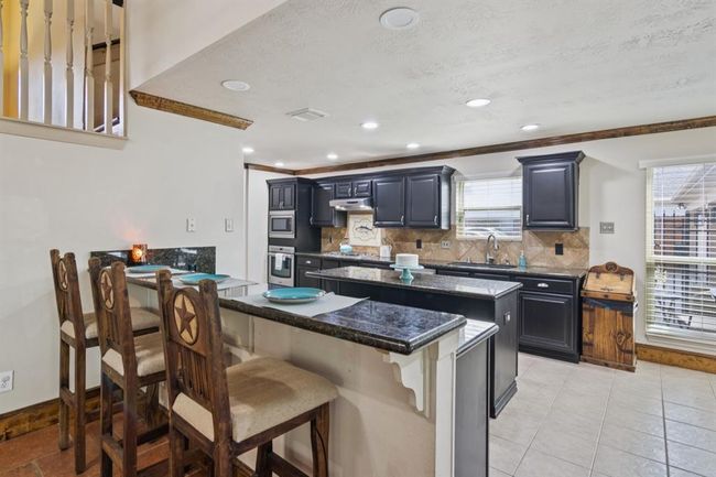 Breakfast bar seats 3. This kitchen is great for entertaining and holiday gatherings. | Image 15
