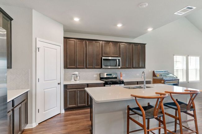 Kitchen with island. | Image 4