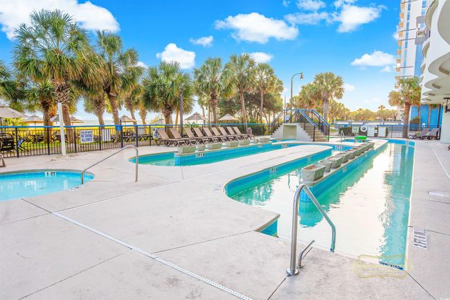View of swimming pool featuring a patio area | Image 17