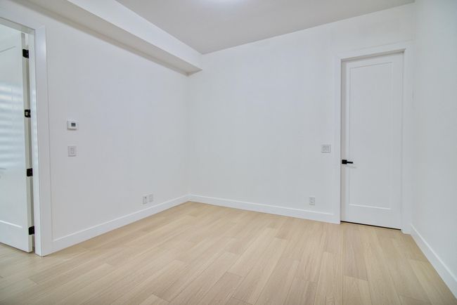 Unfurnished room with light wood-type flooring and baseboards | Image 20