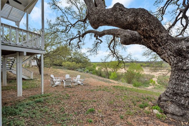 View of yard featuring a wooden deck and stairway | Image 29