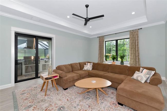 Family Room opens to Lanai and Pool | Image 21