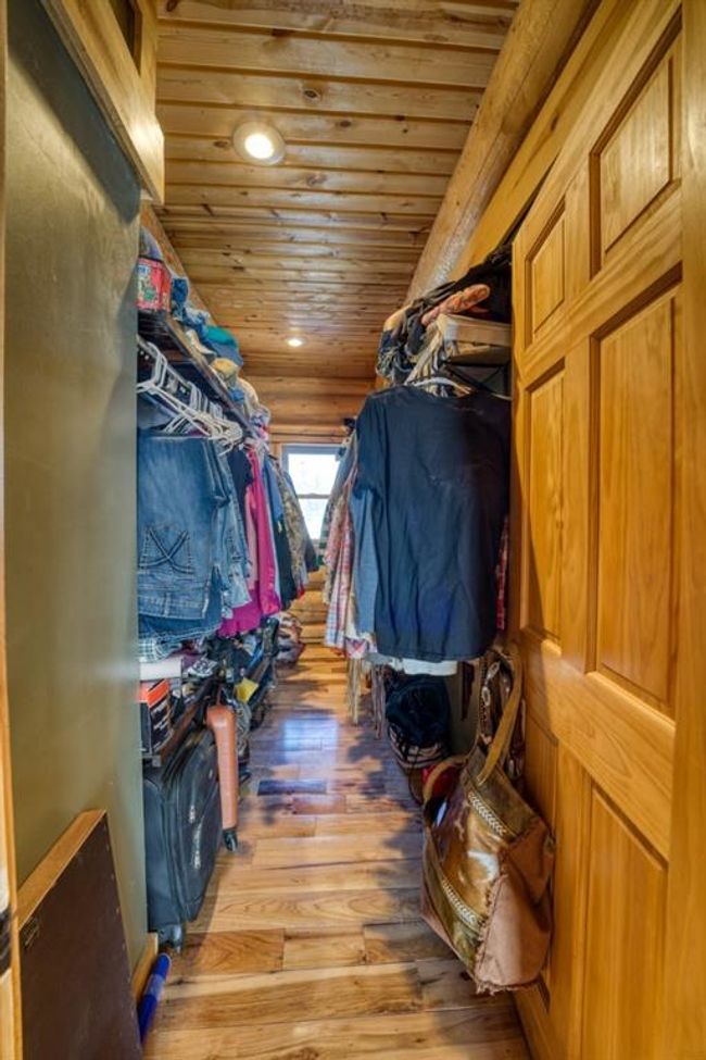 Spacious closet featuring hardwood / wood-style floors | Image 21