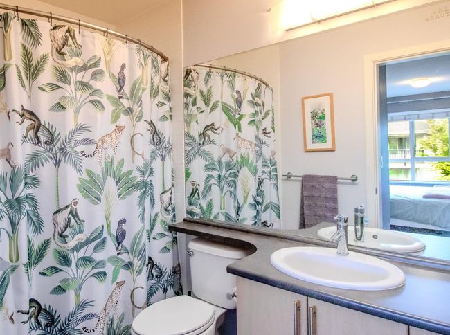 Full bathroom featuring vanity and a shower with shower curtain | Image 11