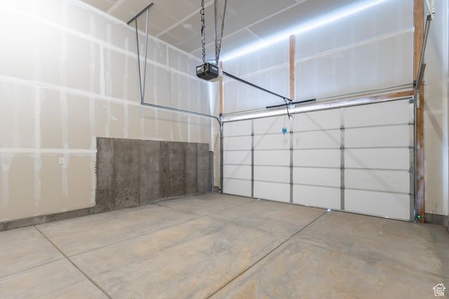 Garage with a garage door opener | Image 27