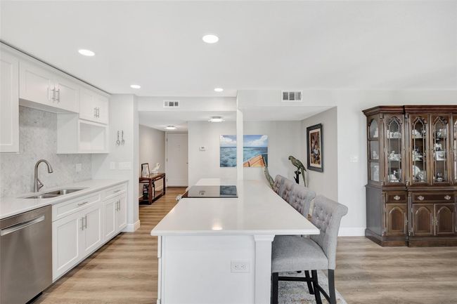 the kitchen is open to the dining area and living area | Image 6
