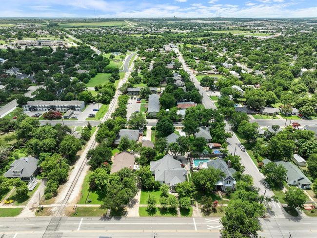 Aerial view of residential area featuring a tree filled landscape | Image 36
