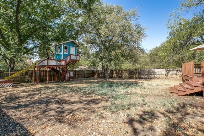 Fenced backyard featuring stairway and a deck | Image 23