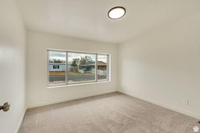 Empty room with baseboards and carpet | Image 17