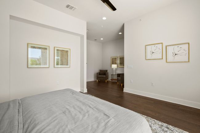 Bedroom with dark wood-style flooring, baseboards, recessed lighting, and a ceiling fan | Image 12