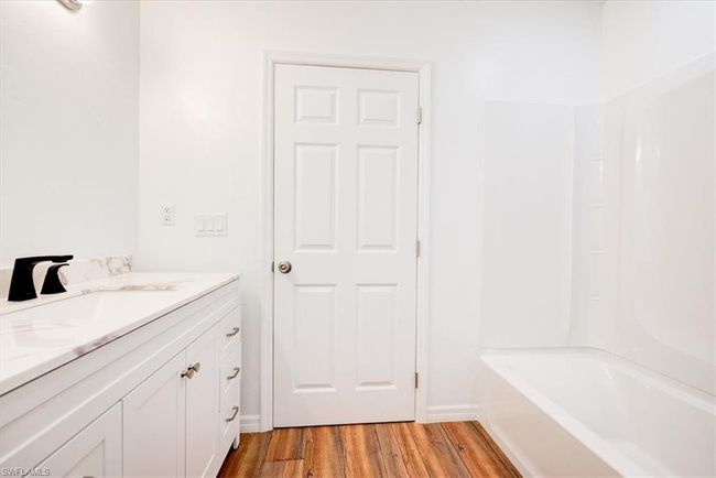 Bathroom featuring wood finished floors and vanity | Image 28
