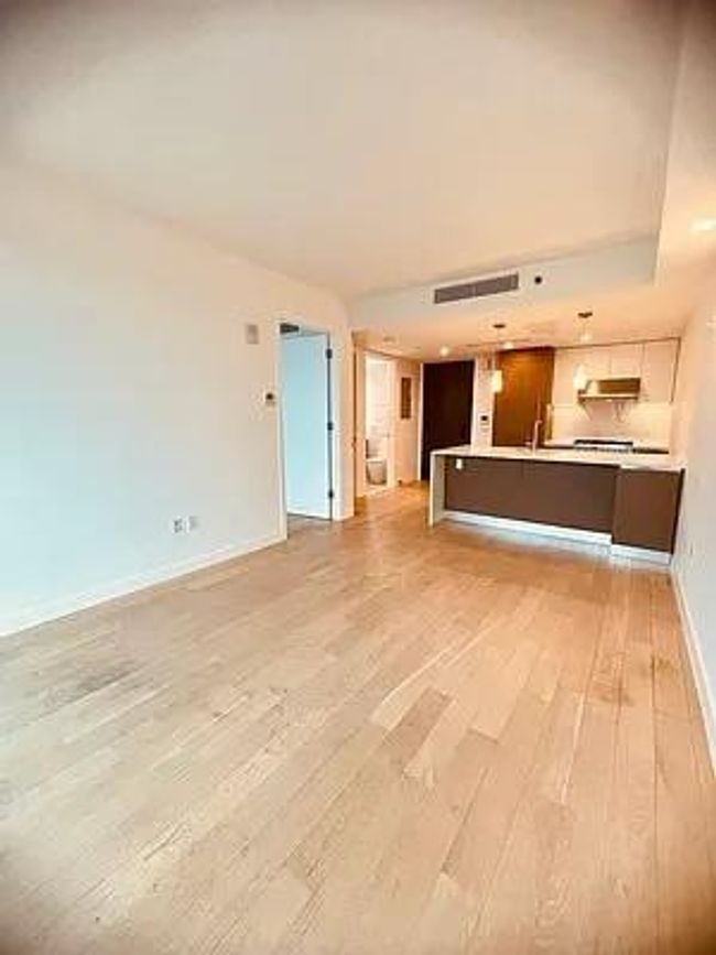 Unfurnished living room with light wood-type flooring and baseboards | Image 20