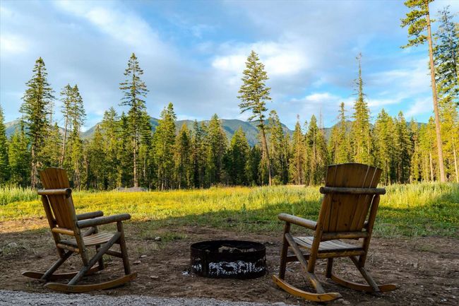 View of yard with a fire pit, a wooded view, and a mountain view | Image 34