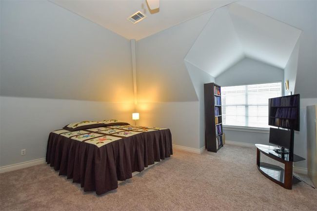 3rd Floor bedroom # 4 with vaulted ceilings, neutral wall paint. Can be used as a flex / hobby room or an office. | Image 24