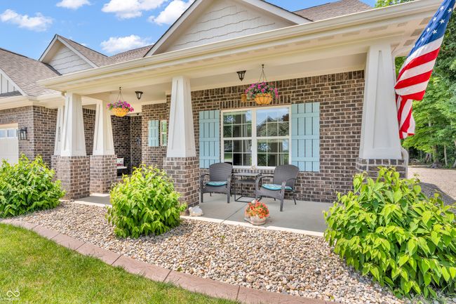 entrance to property featuring brick siding and covered porch - welcome home! | Image 43