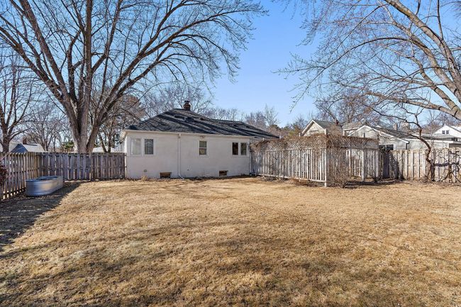 The backyard is spacious and fenced in for privacy. | Image 27