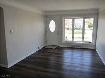 Foyer entrance featuring ornamental molding and dark hardwood / wood-style flooring | Image 3