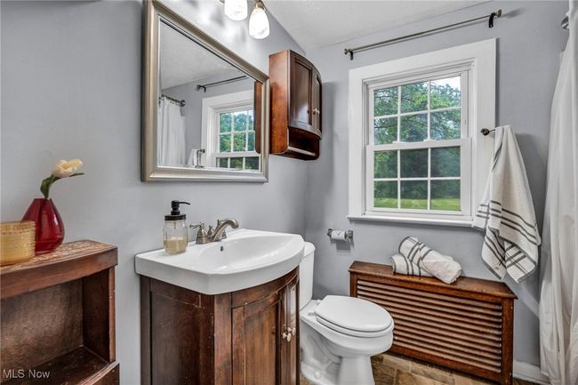 Bathroom with plenty of natural light and vanity | Image 20
