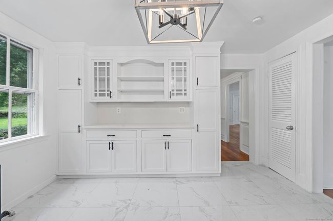 The kitchen has built-ins for displaying your china. | Image 11