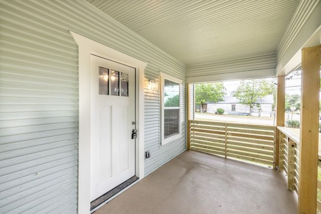 Entrance to property with a porch | Image 24