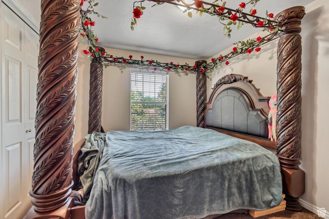 Carpeted bedroom with baseboards | Image 13