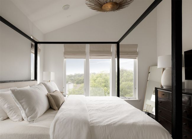Bedroom featuring vaulted ceiling and multiple windows | Image 28
