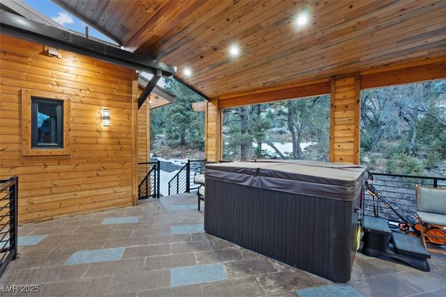 View of patio featuring a hot tub | Image 74