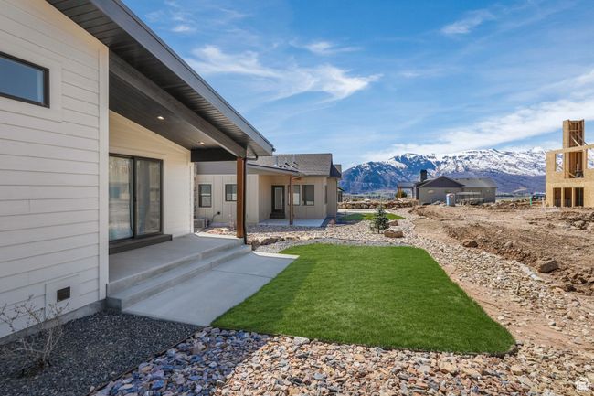 The primary suite opens to a serene outdoor patio, offering a peaceful retreat just steps away. | Image 49