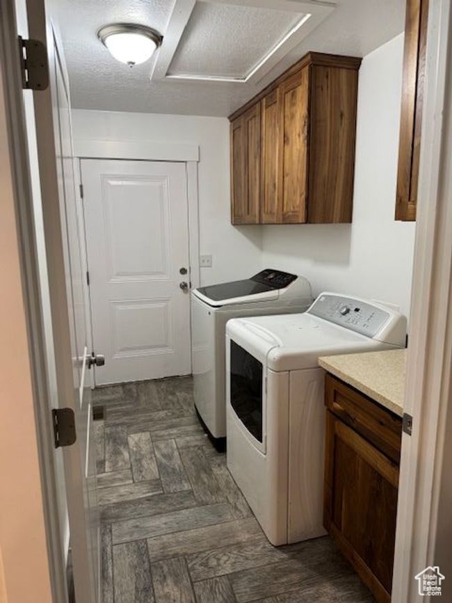 Laundry area with cabinet space and washer and dryer | Image 22