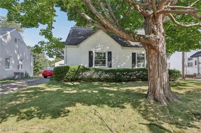 View of front of house featuring central AC unit and a front yard | Image 2