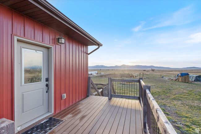Wooden deck featuring a mountain view | Image 37