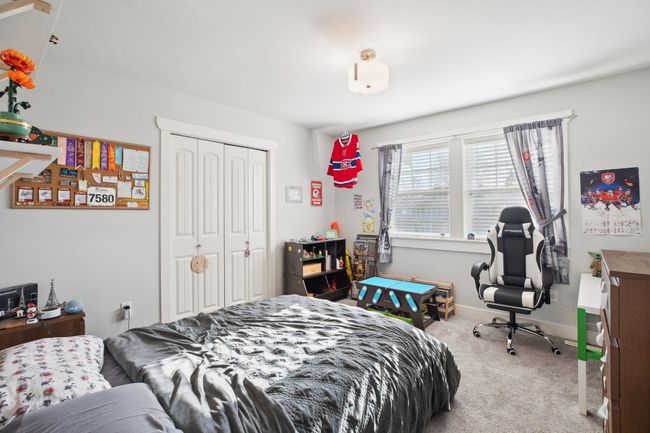 Bedroom with carpet floors, baseboards, and a closet | Image 24