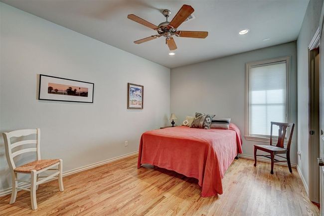 Bedroom with recessed lighting, light wood-style floors, a ceiling fan, and baseboards | Image 29