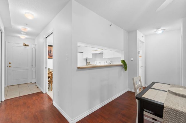 Hallway featuring dark wood-style floors and baseboards | Image 6