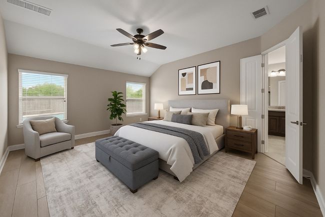 Bedroom featuring multiple windows, light wood-style floors, ceiling fan, and vaulted ceiling | Image 13