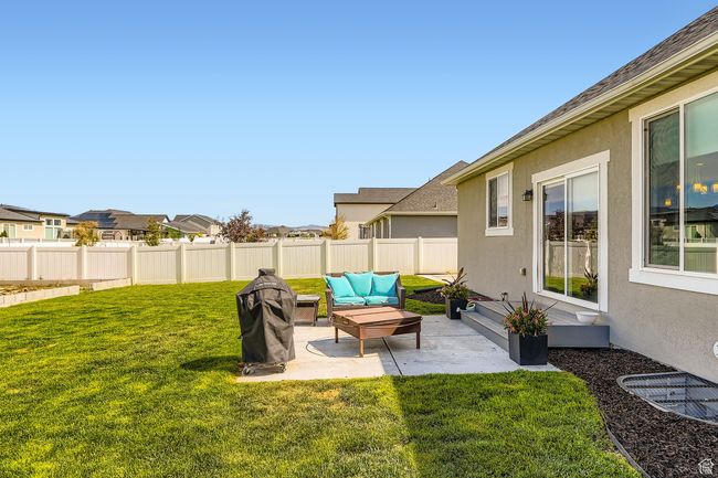 View of yard featuring a patio and a residential view | Image 22