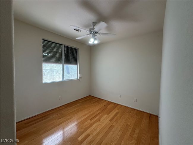 Empty room featuring light wood-style floors, a ceiling fan, and baseboards | Image 25