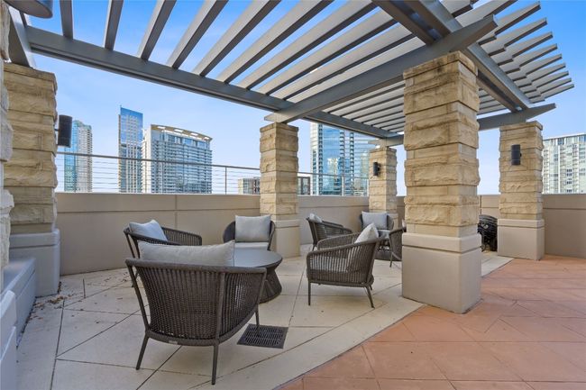 View of patio / terrace with an outdoor living space, a pergola, and a city view | Image 24