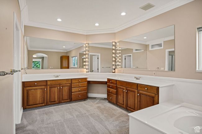 Bathroom with vanity, recessed lighting, crown molding, and a bathtub | Image 18